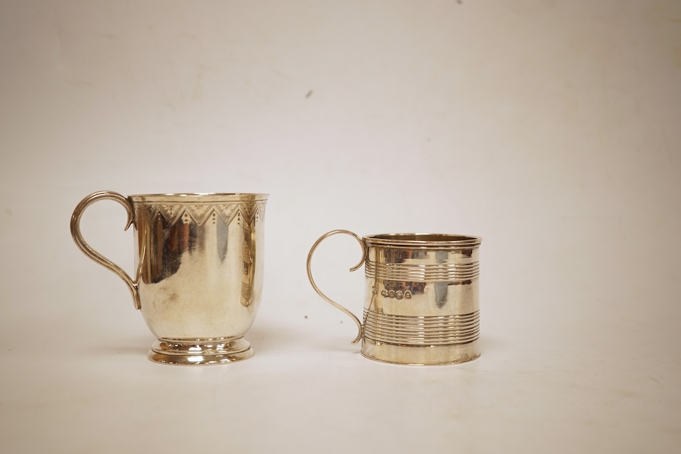 A small late George III reeded silver christening mug, London, 1818, height 51mm, together with a later Victorian silver christening mug, Arthur Sibley, London, 1764.